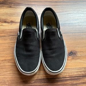Woman’s black slip on vans